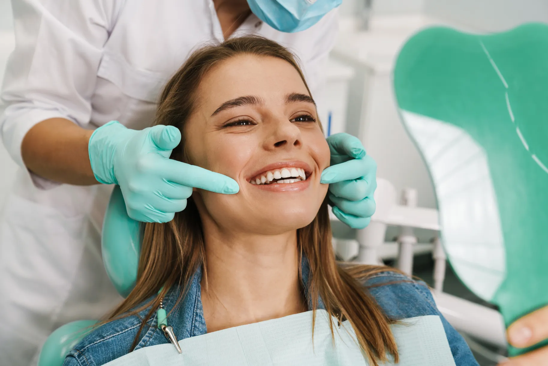 Woman and dentist showing her new smile